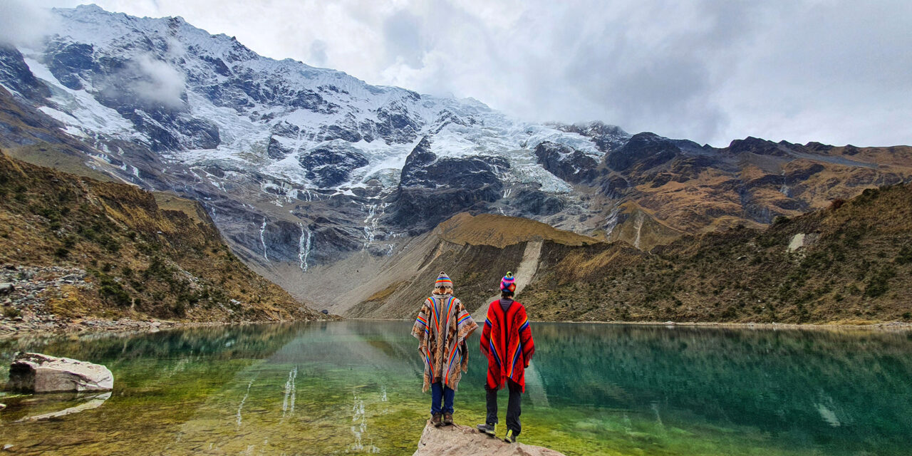Couple contemplating the Humantay Lagoon, Peru Photo by Private Machu Picchu