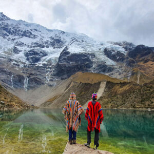 Couple contemplating the Humantay Lagoon, Peru Photo by Private Machu Picchu