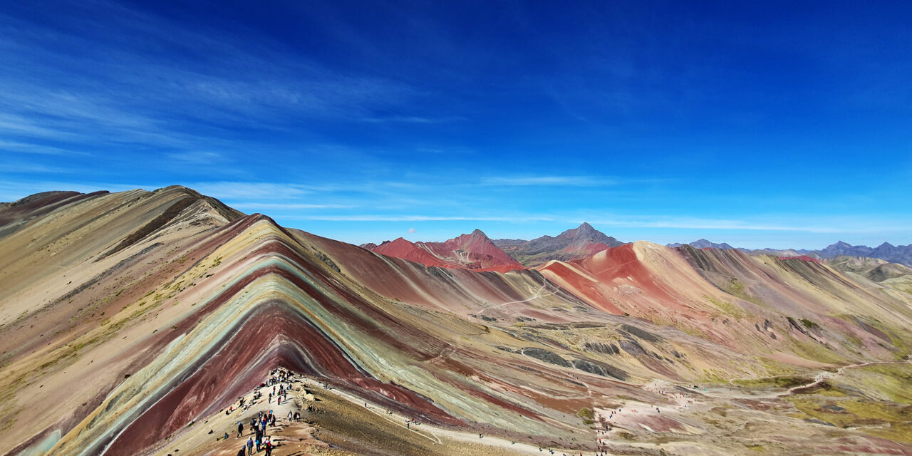 Wide angle photo of Rainbow Mountain Peru